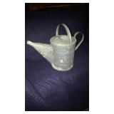 Vintage galvanized watering canteen