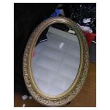 Oval floral framed medicine cabinet and mirror