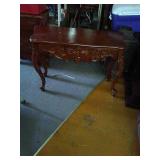 Nice carved entry way table. Needs repairs on