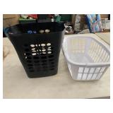 2 laundry baskets - handles are cracked on white