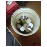 Bucket of home repair sprays and sealants.