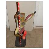 Iron Stripper on Pole Sculpture - by Dick Manlin