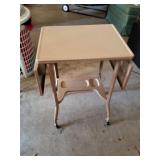Metal Table with Drop Leave sides and Rollers /