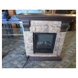 Faux Stone Fire Place. Some Damage as pictured.