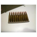 (70) 5.56 CARTRIDGES W/ MILITARY AMMO POUCH