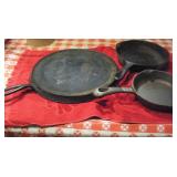2 CAST IRON SKILLETS & A GRIDDLE