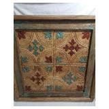 Tin artwork in heavy wooden frame