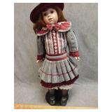 Coca Cola brand porcelain doll with removable hat