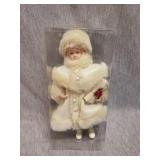 Christmas  themed porcelain doll with gift in hand