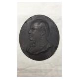 Profile of William McKinley. Metal