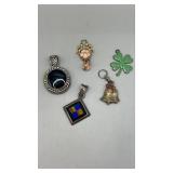 Five assorted pendants. Diamond shaped is marked