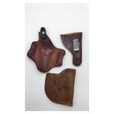 (3) Leather handgun holsters. One needs