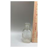 Vintage Amsco Doll E Toys Glass Bottle. Stands 3"