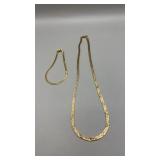 Gold Herringbone necklace and gold bracelet. No