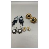 4 Pair of fashioned pierced earrings. 1 is