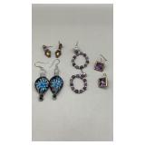 Four pair of fashionable ladies earrings.
