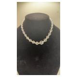 Two beautiful fashionable ladies necklaces .