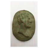 1933 Abraham Lincoln profile in red clay."Clay