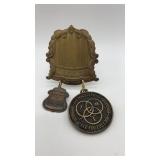 Assorted vintage metal medallions.