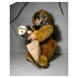Native American child holding bear. Enchanted