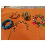 5 Assorted Fashioned bracelets. MONET gold tone