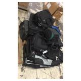 Pallet of new luggage, body bags, and computer