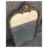 Ornate guilded wall mirror