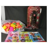 Lot of water squirters, erasers, and assorted toys