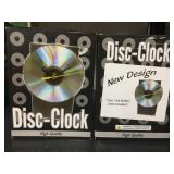 Pair of new in box Disc Clocks