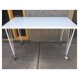 White writing table/desk on rolling lockable