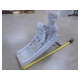 Plaster Boy and Girl on Slide