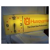 Lighted Husqvarna sign with clock