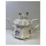 A Teleflora Gift Ceramic Tea Pot very colorful,