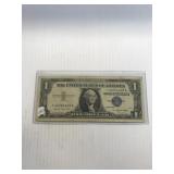 1957 A Blue Seal One Dollar Silver Cent