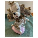White/Grey Poodle sitting on pink cushion-figurine