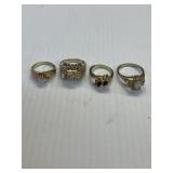 4 Various size plated cocktail rings 1 opal