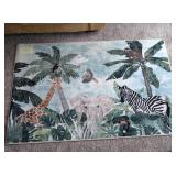 Jungle themed area rug. 57x36. Great condition wit