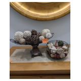 2 decorative metal baskets and decor.