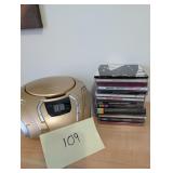 CD player. Works. 14 music CDs