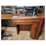 Antique Singer sewing machine in cabinet - tested