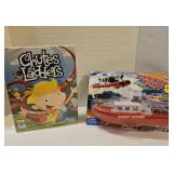 Toy lot. Rescue boat, chutes and ladders game.