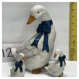 Vintage porcelain duck figurines w/ blue bows; 8"