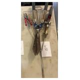 Gardening tools on metal staked holder