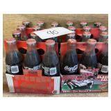 (4) vintage coca cola bottles in cases - unopened