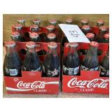 (4) vintage coca cola bottles in cases - unopened
