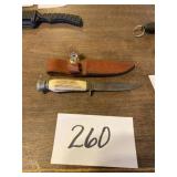 Bone handle hunting knife with scab