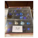 Box of blue glass Christmas tree decorations