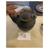 Cast-iron teapot with brass handle