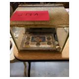 Glass box with assorted foreign coin