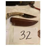 Small stone knife with sheath antler handle